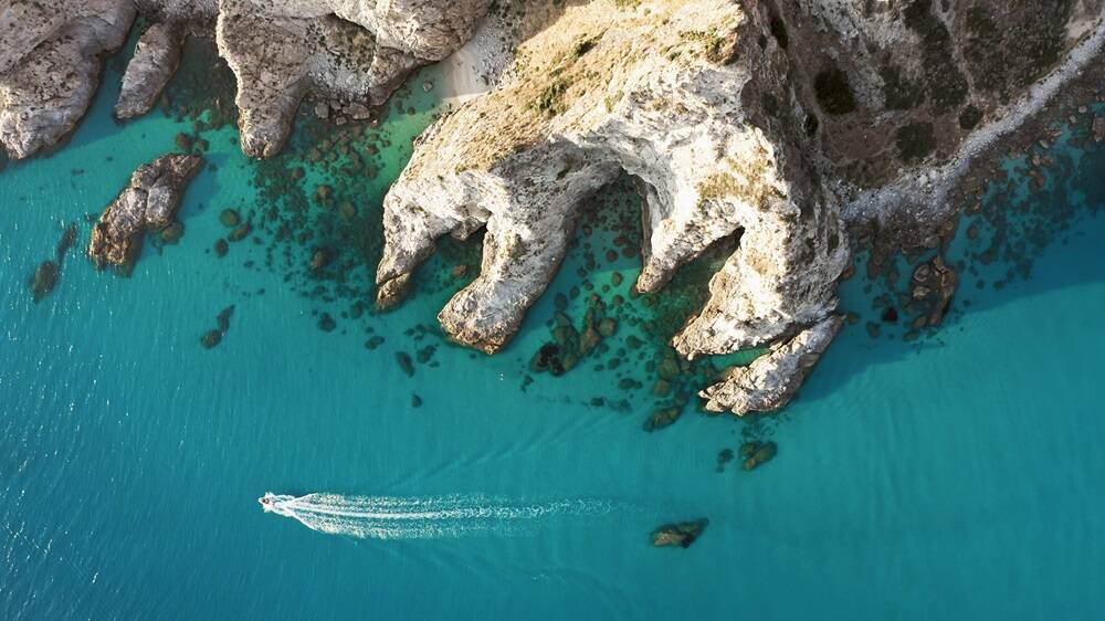 The cliff near a spectacular sea in Summer season